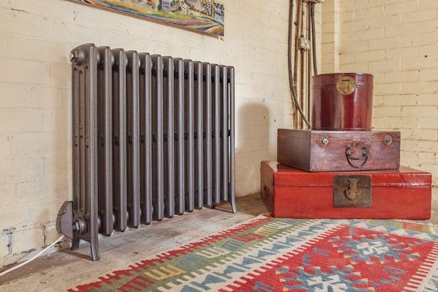 Electric Etonian cast iron radiator in gun metal
